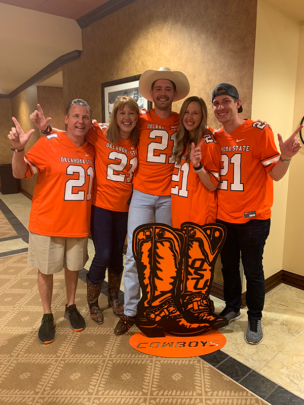 Vickie Carr and members of her family wear matching OSU jerseys to the football game.